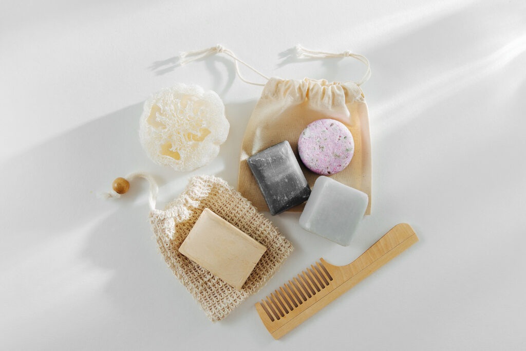 A zero-waste bathroom setup with eco-friendly solid shampoo bars in minimalist packaging.