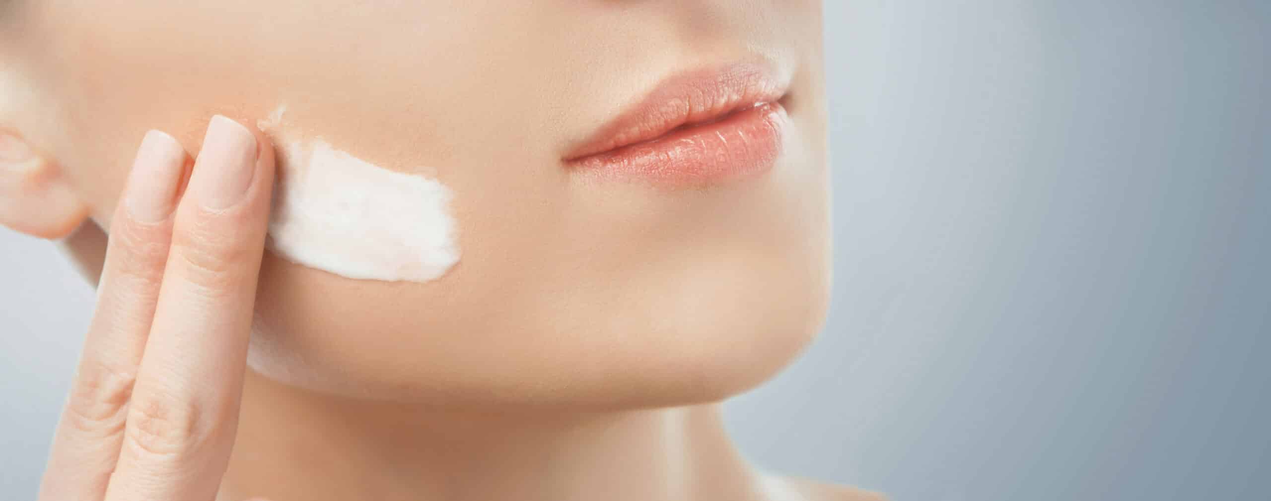 Close up texture of a barrier repair cream formulated with ceramides and cholesterol showing a rich lamellar emulsion structure.
