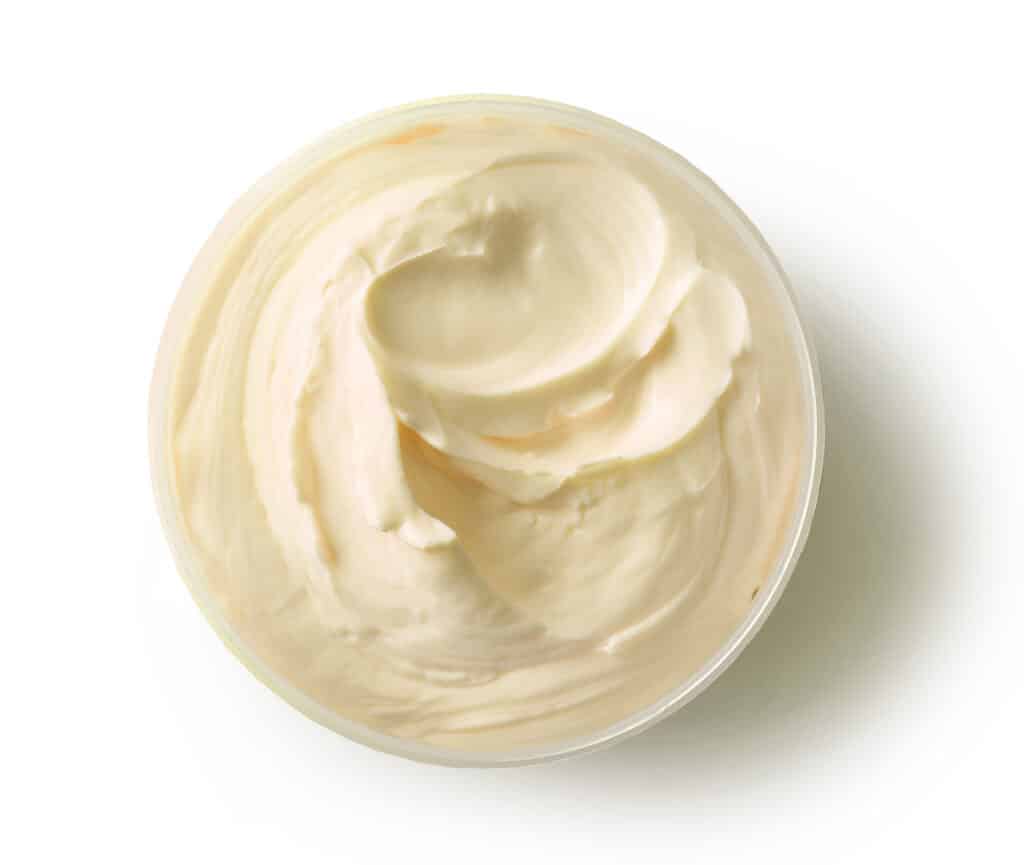 Close-up texture of a smooth, professionally formulated whipped beef tallow balm, demonstrating the process of formulating with beef tallow without graininess.